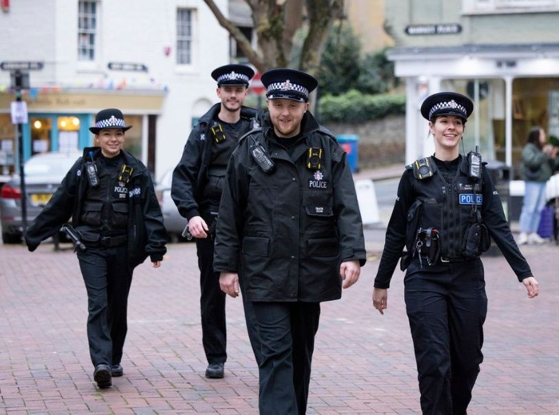 Four police Officer walking down the street